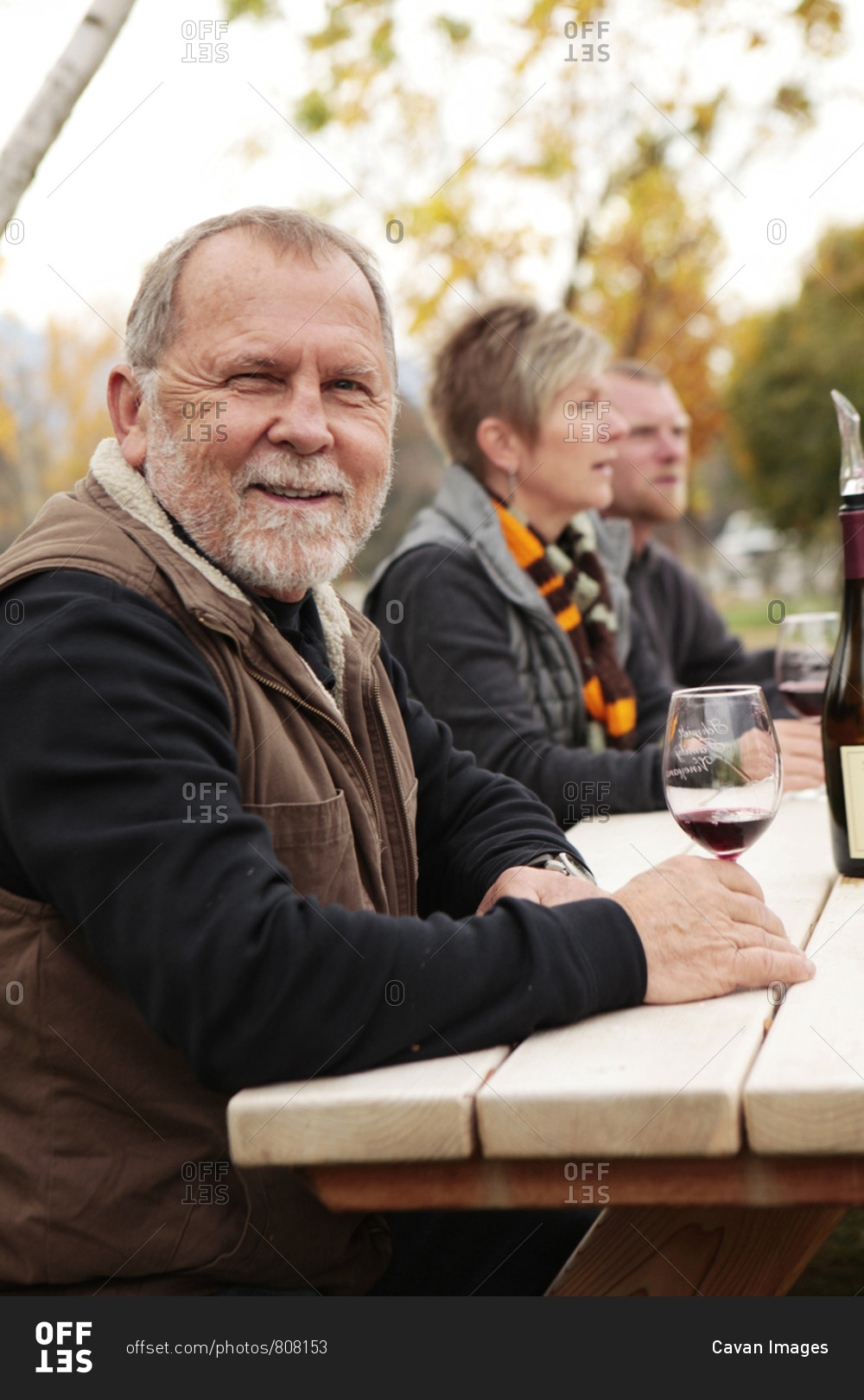 USA, Oregon, Medford, - November 2, 2012: Cal Schmidt enjoys\
a glass of wine on his farm with friends, Schmidt Family Vineyards\
is located in the beautiful Applegate Valley and is owned by Judy\
and Cal Schmidt, the winery consists of country charm, beauti
