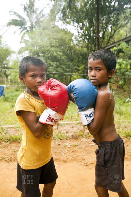 PHILIPPINES, Palawan, Sabang,  - February 9, 2011: young boys practice their boxing in the countryside near Sabang beneath the Marble Mountains