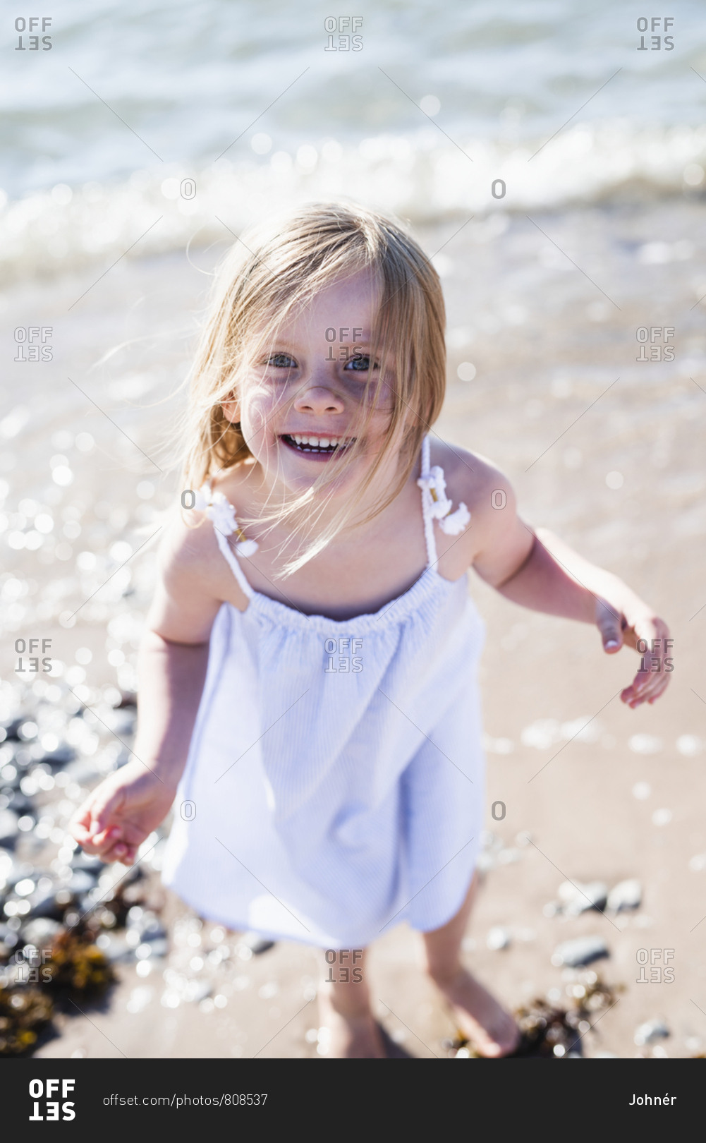 Happy girl on beach - Offset stock photo - OFFSET