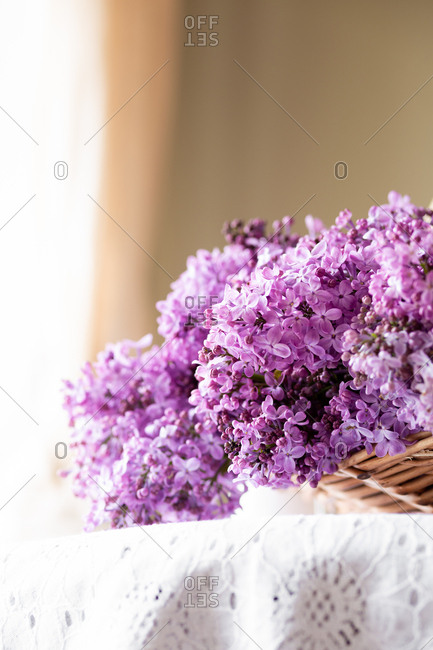 Purple lilacs in a basket