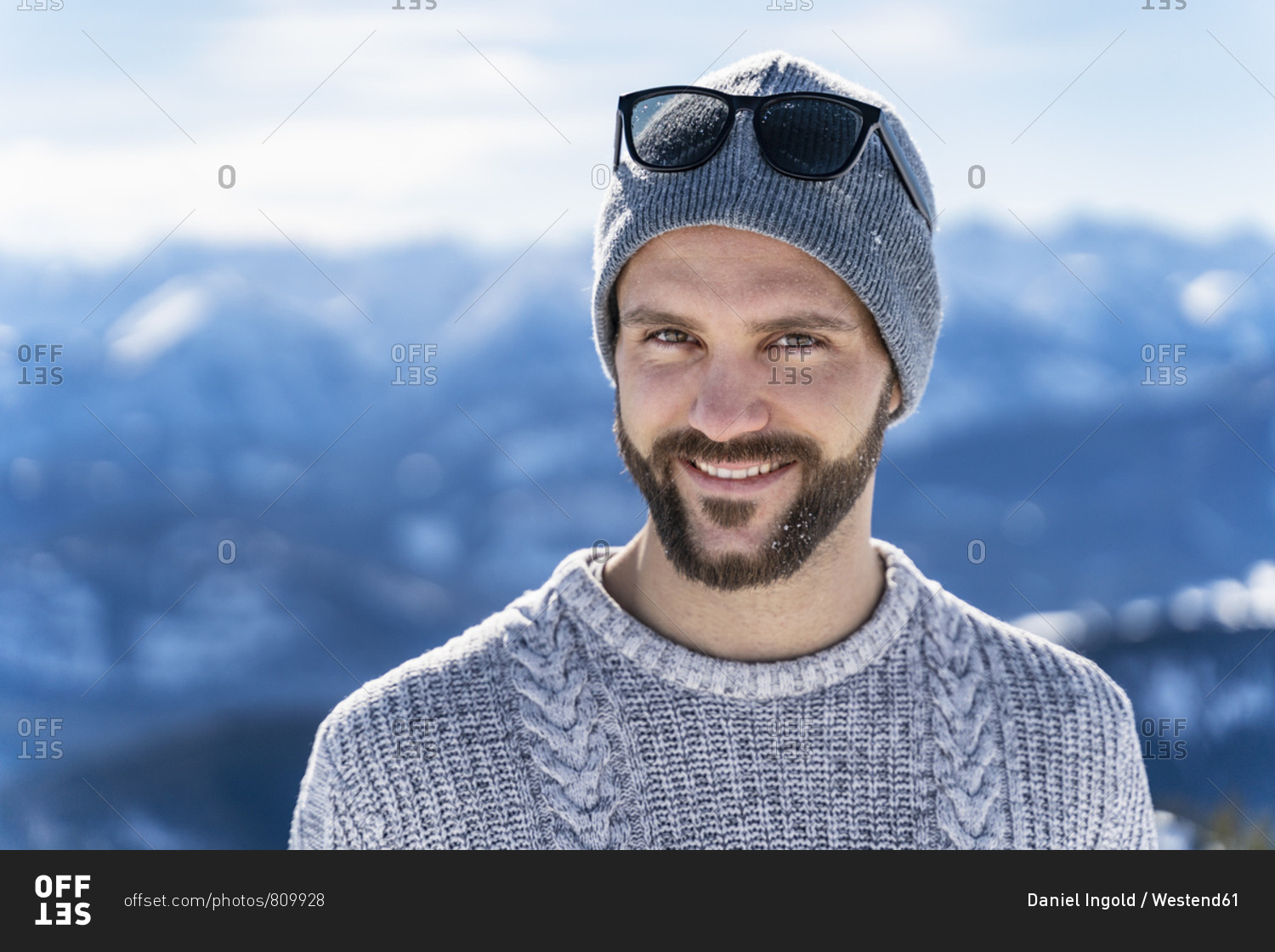 Germany- Bavaria- Brauneck- portrait of smiling man in winter in the mountains