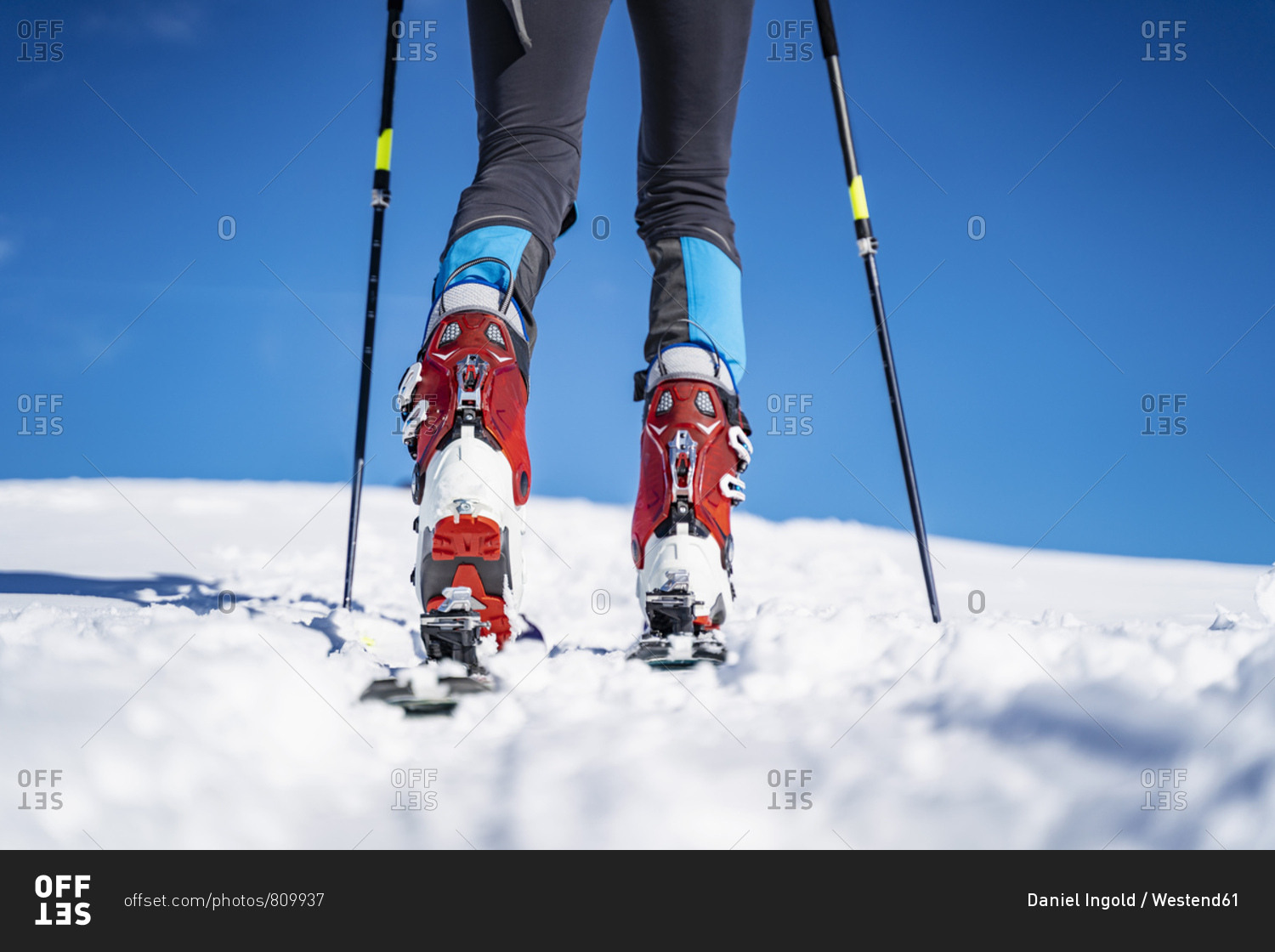 Legs of a man on a ski tour in winter in the mountains