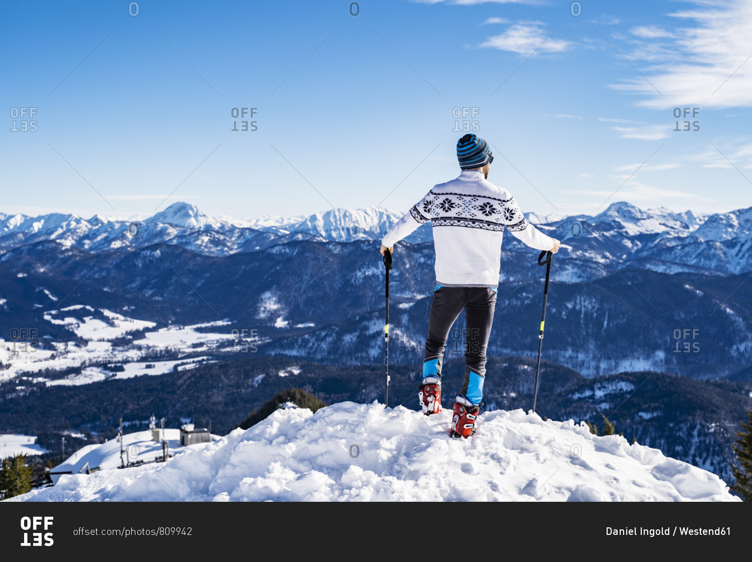 Germany- Bavaria- Brauneck- man in winter standing on mountaintop