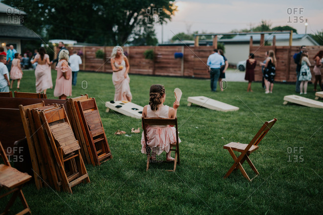 Groom throwing garter at wedding