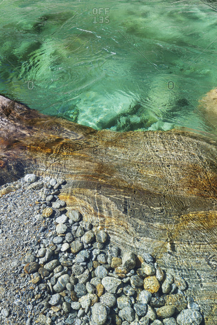 Switzerland- Ticino- Verzasca Valley- stones and rocks in clear turquoise waters of Verzasca river