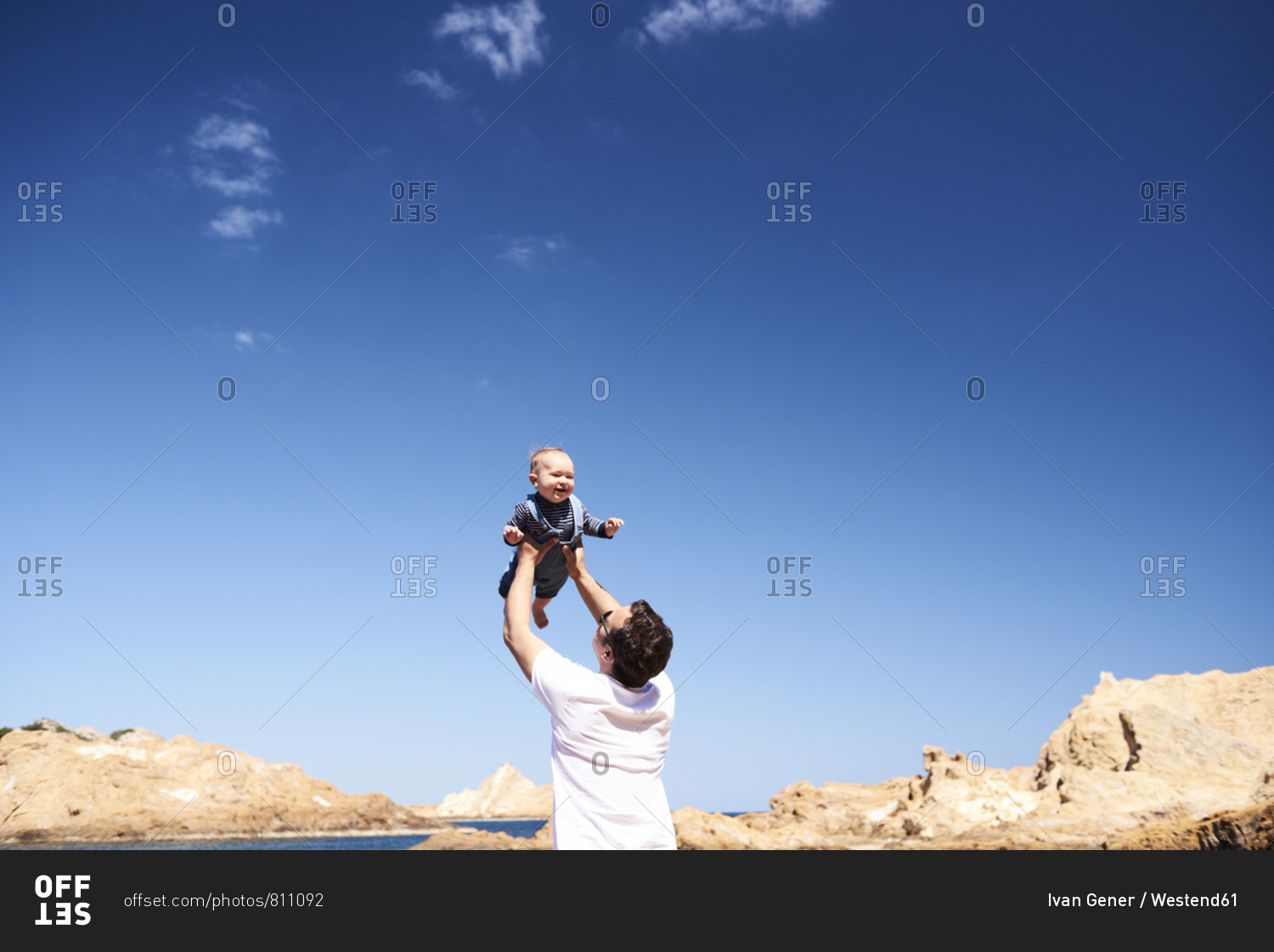 Spain- Menorca- father playing with little son on the beach