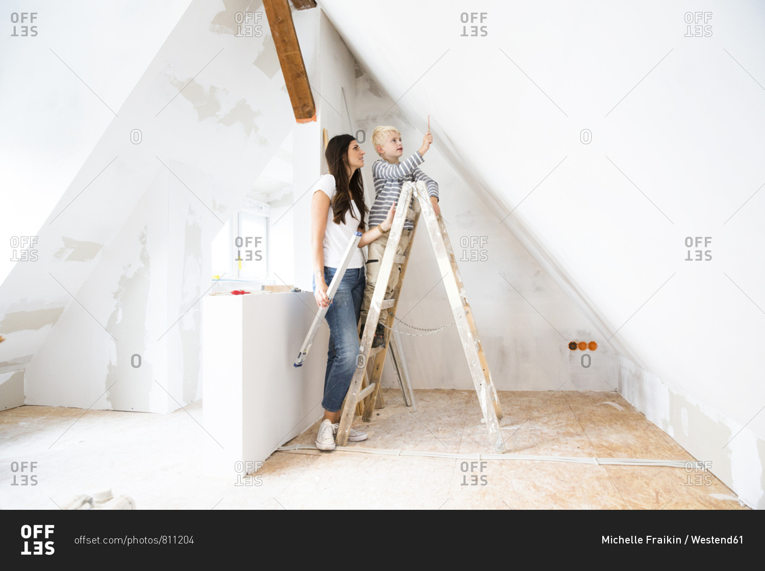 Mother and son working on loft conversion