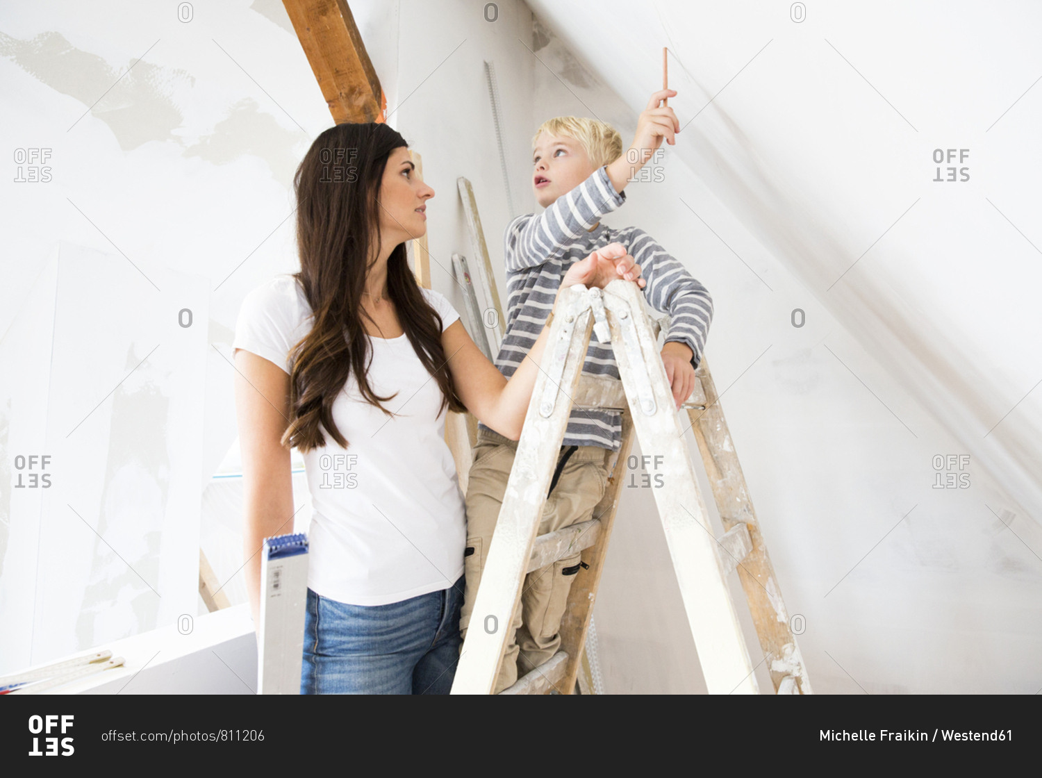 Mother and son working on loft conversion