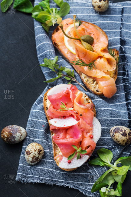 Fish appetizers on striped towel