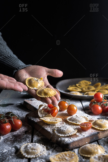 Homemade ravioli made with parmesan cheese, tomato and basil. Typical dish of Italian cuisine