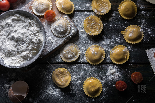 Homemade ravioli made with parmesan cheese, tomato and basil. Typical dish of Italian cuisine