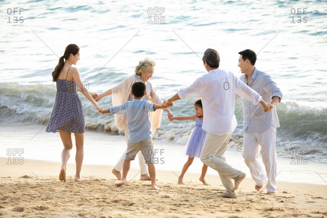 Happy family having fun on beach