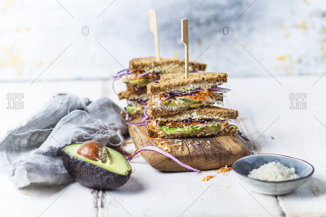 Veggie Sandwich- whole meal toast bread with grated carrot- red cabbage- white cabbage- avocado and cheese