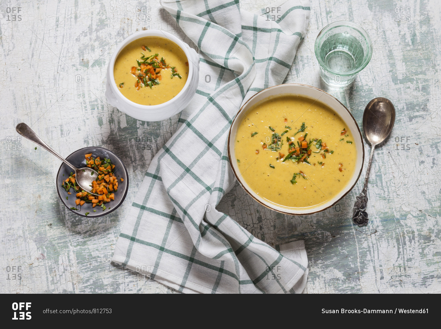 Bowls of vegan creamy carrot soup with coconut milk