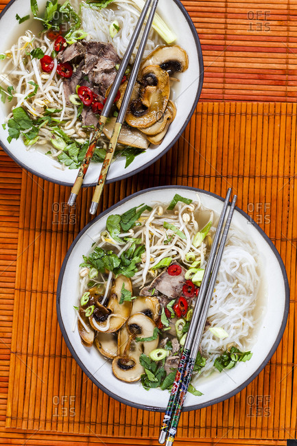 Vietnamese rice noodle soup with mushrooms and beef