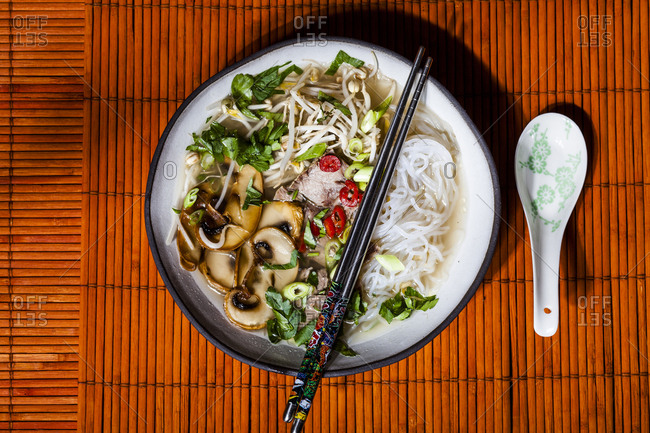 Vietnamese rice noodle soup with mushrooms and beef