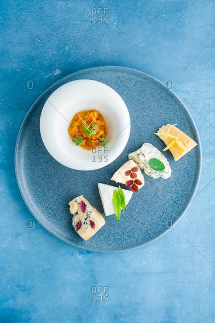 Cheese appetizer on blue background