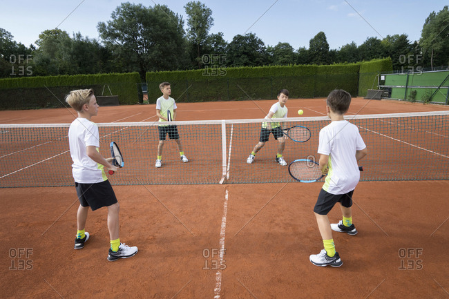 Young boys playing tennis, Bavaria, Germany