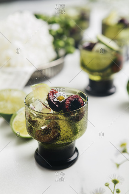 Refreshing mock cocktail with cherries and edible flowers