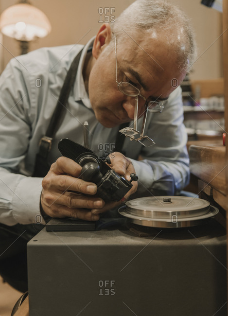 Artisan making jewelry in his workshop