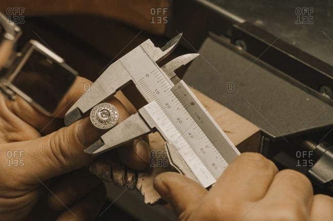 Artisan making jewelry- fixing ring