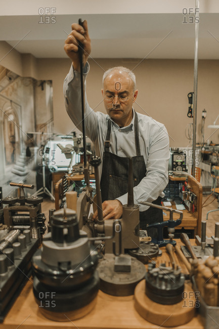Artisan making jewelry in his workshop