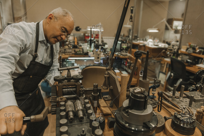 Artisan making jewelry in his workshop