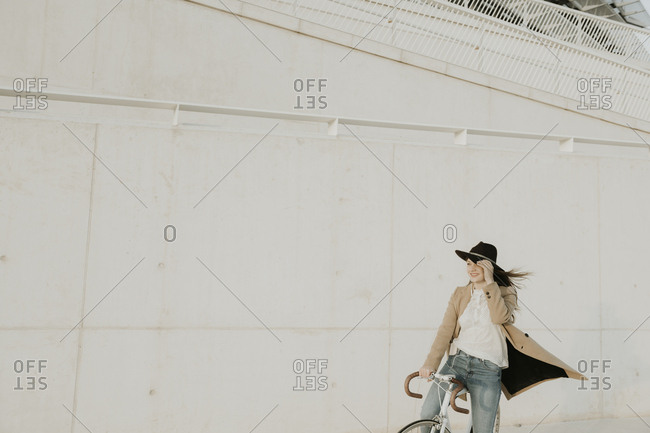Young hipster woman with a bicycle