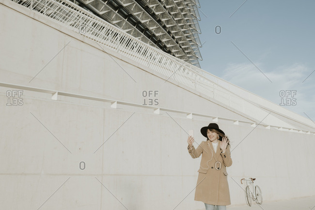 Young hipster woman doing video conference
