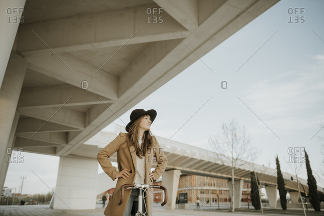 Young hipster woman with a bicycle