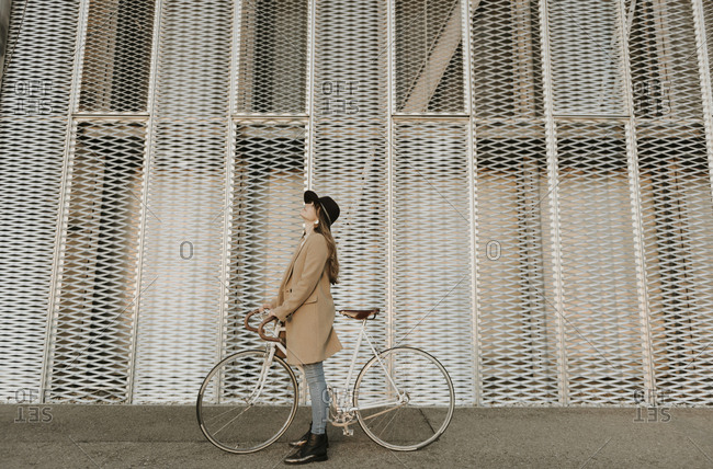 Young hipster woman with a bicycle
