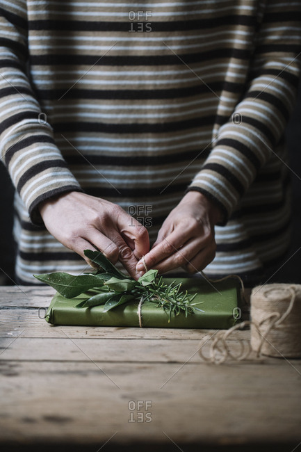 Woman's hands wrapping present - Offset