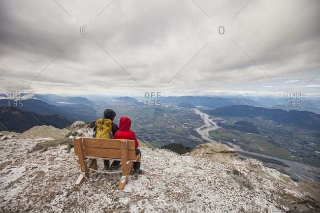 Father and son view the Fraser valley for the summit of Mt Cheam.
