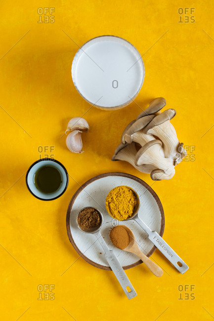 Mushroom and other ingredients on a yellow background
