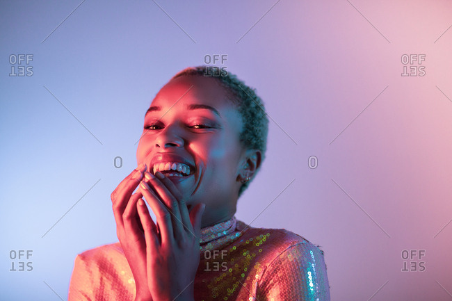 Creative shot of young adult female laughing