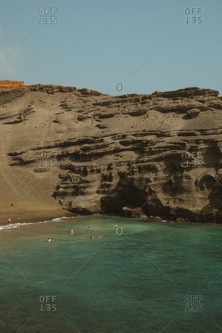 Hawaii - January 14, 2018: Tourists swimming at Papakolea Beach, Hawaii