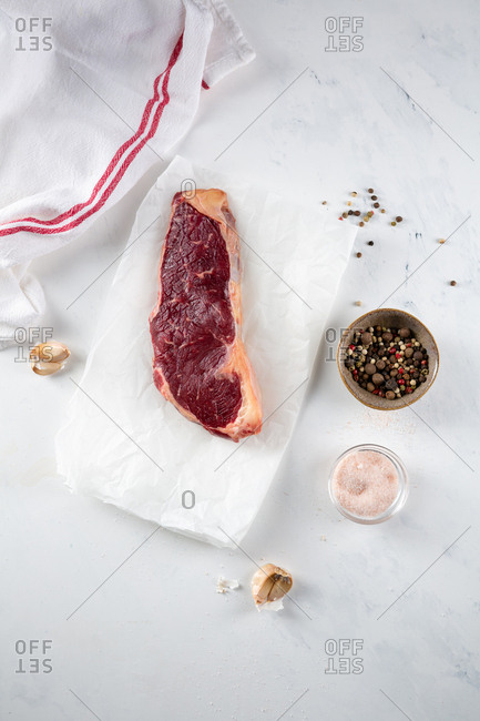 Raw red meat on white background