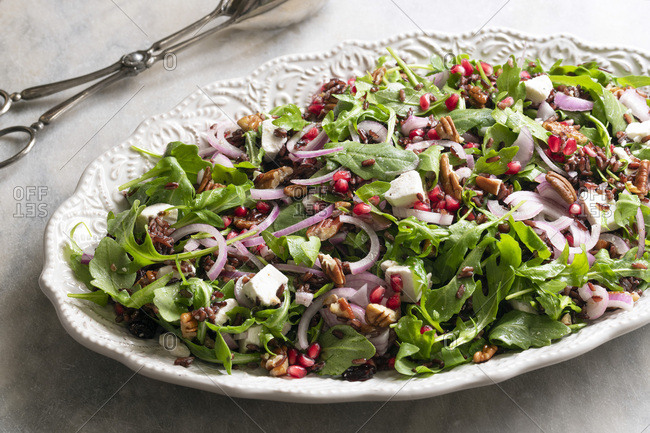 A healthy rocket, pomegranate and rice salad.