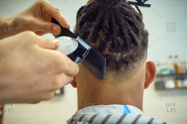 Crop View From Behind Of Anonymous Hairstylist Doing A Modern