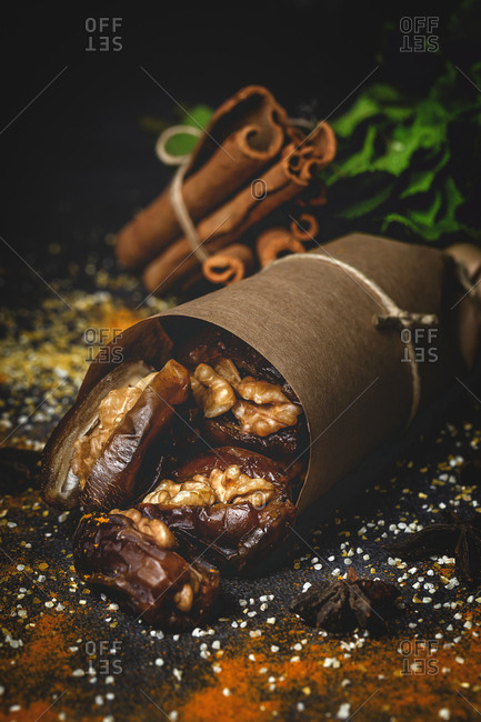 Dates fruits with walnuts, mint and cinnamon Muslim halal snack for Ramadan