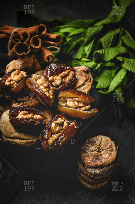 Dates fruits and dried figs with walnuts, mint and cinnamon Muslim halal for Ramadan