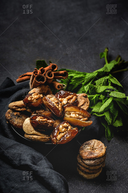 Dates fruits with and dried figs , mint and cinnamon Muslim halal snack for Ramadan