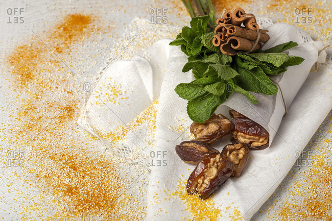 Dates fruits with walnut sand dried figs, mint and cinnamon Muslim halal snack for Ramadan
