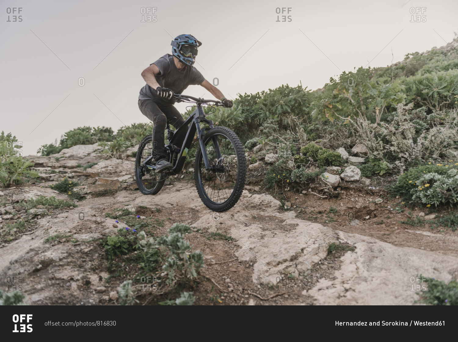 Spain- Lanzarote- mountain biker on a trail in the mountains