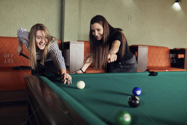 Friends play billiards., Stock image