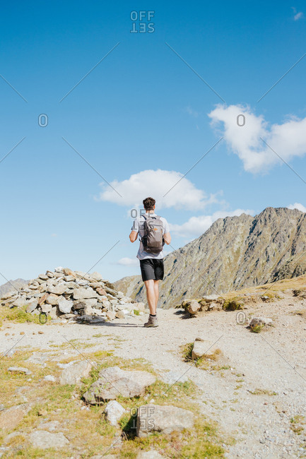 Man hiking a mountain in Andorra during summer