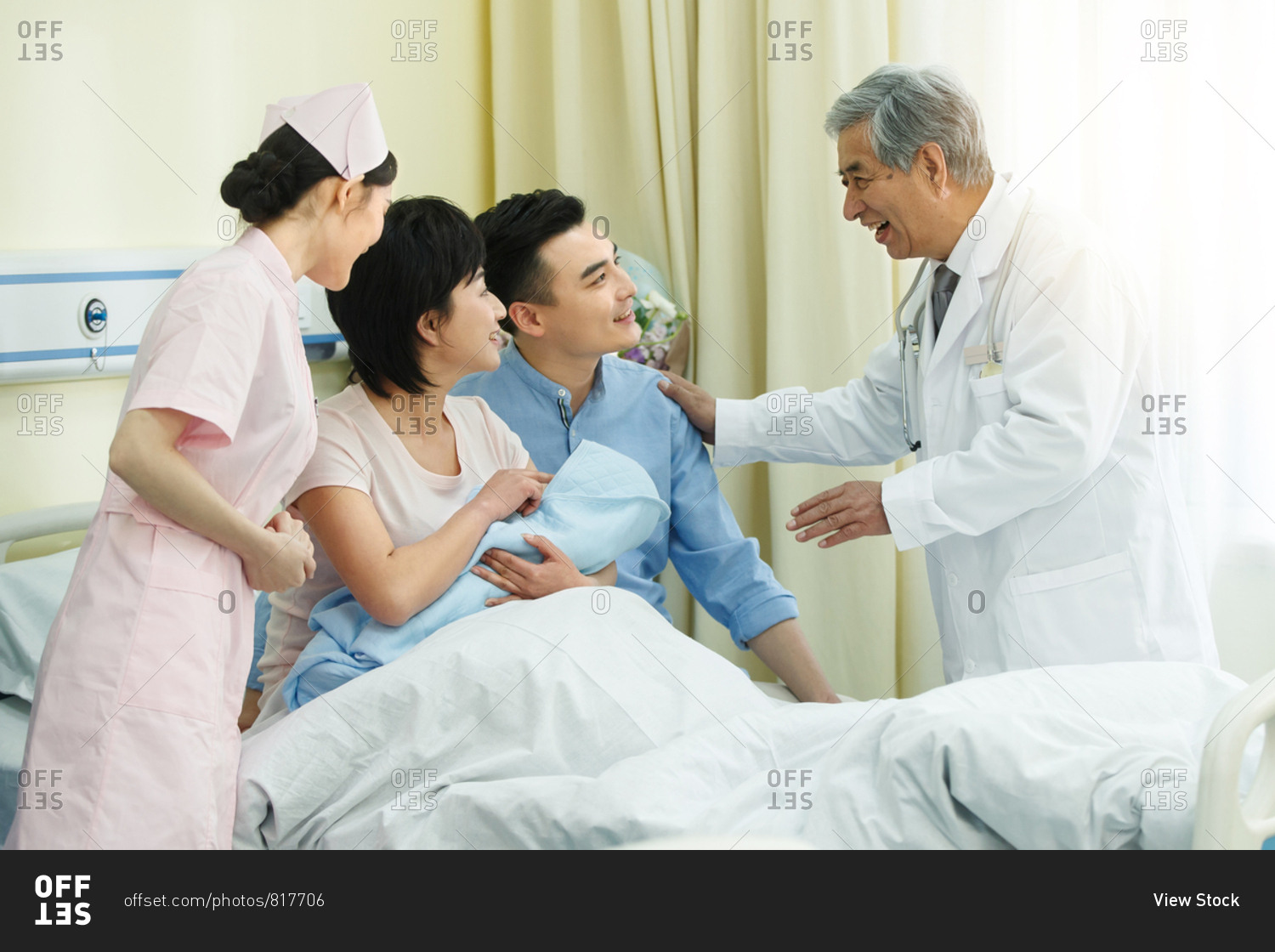 Medical staff and the parents of the newborn