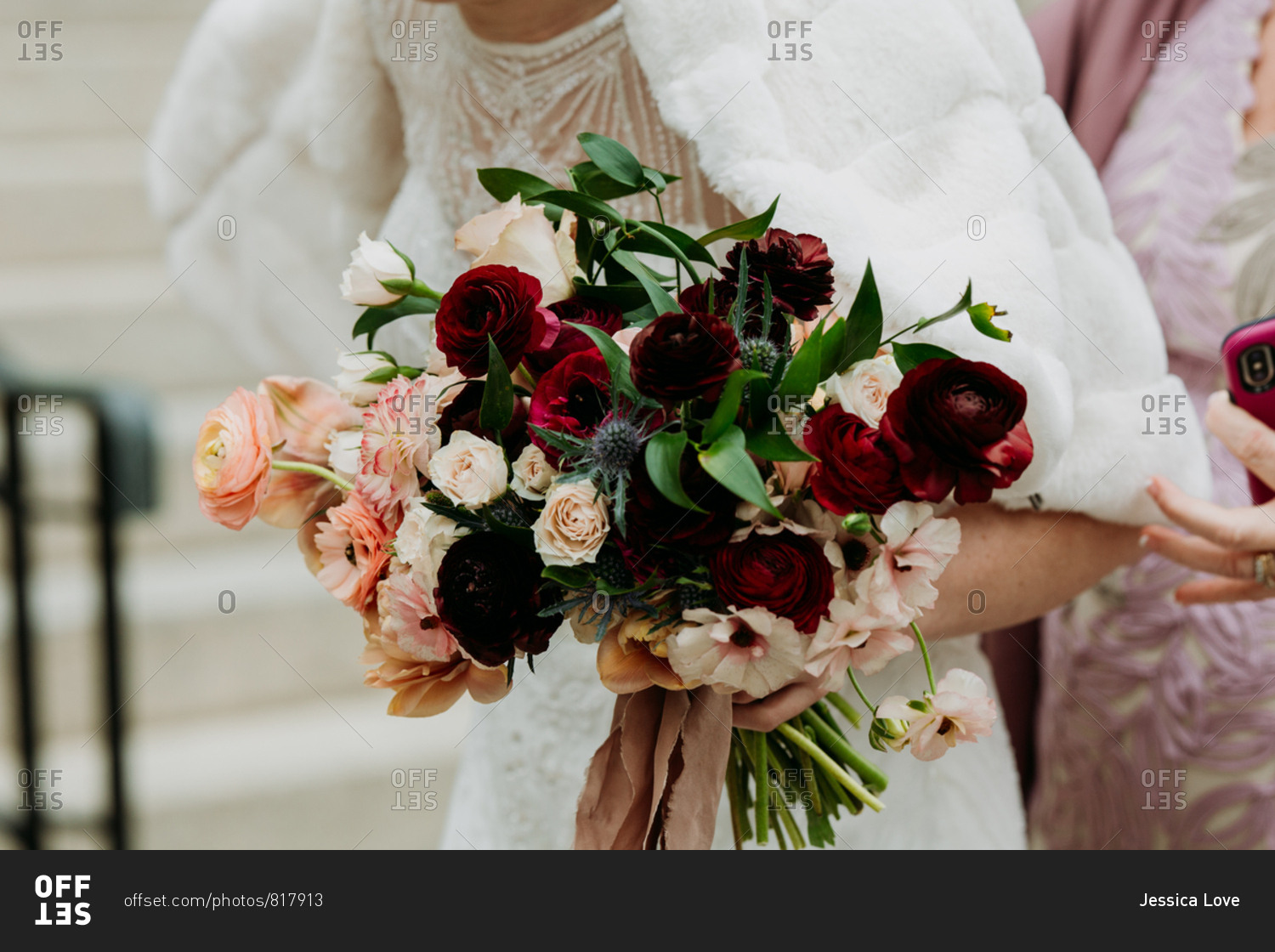 Bride holding rose bouquet