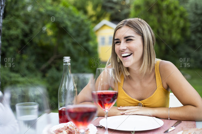 Friends having fun at a summer dinner in the garden