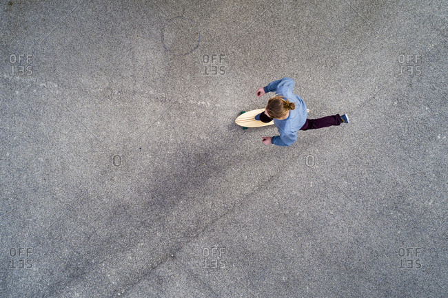 Man longboarding- top view